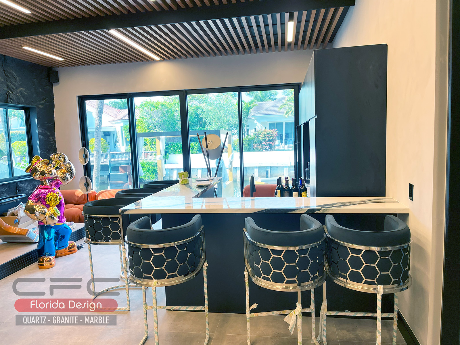 Marble-top bar with black cabinetry